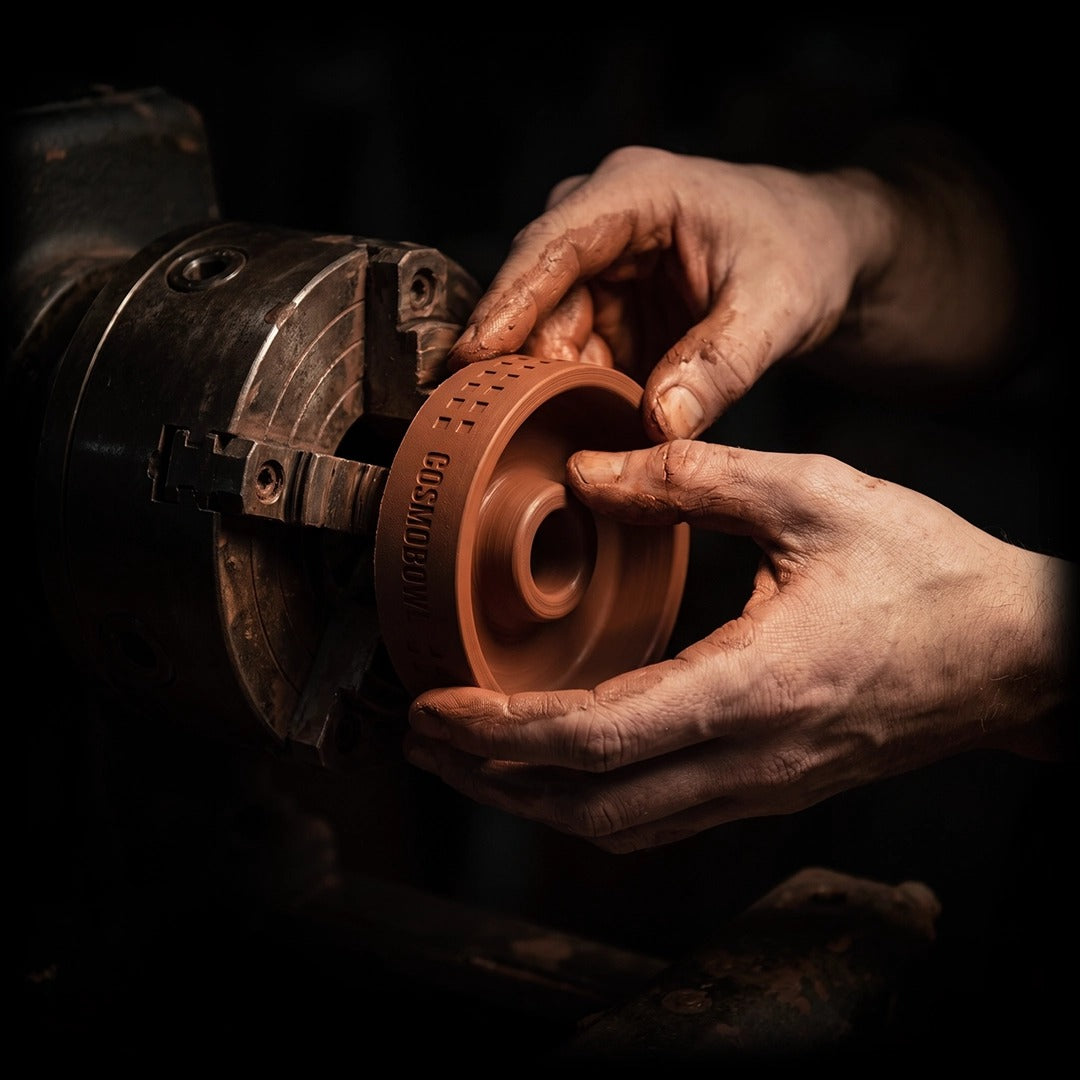 Quasar Raas x Cosmobowl Bowl being shaped from red clay